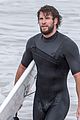 liam hemsworth wetsuit surfing 02