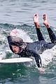 adam brody goes surfing in his wetsuit 02