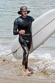 adam brody goes surfing in his wetsuit 05