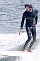 adam brody goes surfing in his wetsuit 11