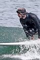 adam brody goes surfing in his wetsuit 12