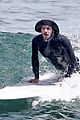 adam brody goes surfing in his wetsuit 13