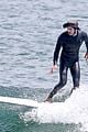 adam brody goes surfing in his wetsuit 19