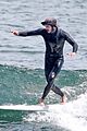 adam brody goes surfing in his wetsuit 20