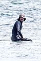 adam brody goes surfing in his wetsuit 22