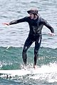 adam brody goes surfing in his wetsuit 24