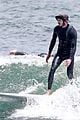 adam brody goes surfing in his wetsuit 25