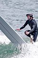 adam brody goes surfing in his wetsuit 26