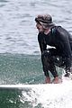 adam brody goes surfing in his wetsuit 29