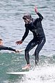 adam brody goes surfing in his wetsuit 30