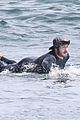 adam brody goes surfing in his wetsuit 33
