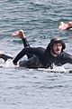 adam brody goes surfing in his wetsuit 34