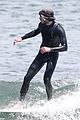 adam brody goes surfing in his wetsuit 35