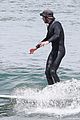 adam brody goes surfing in his wetsuit 37