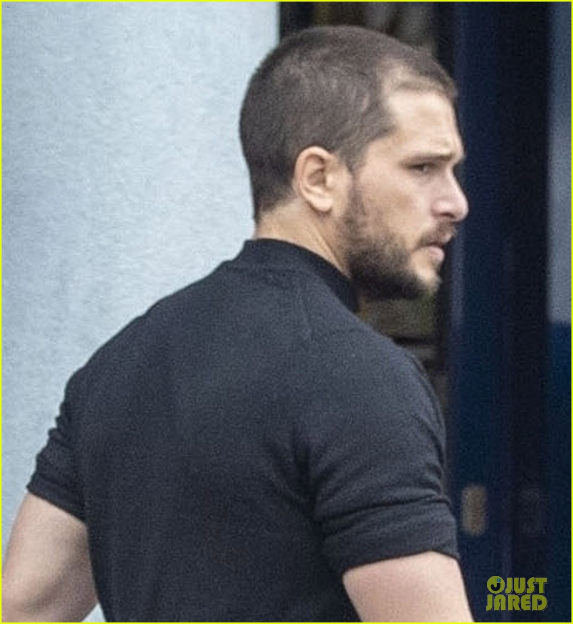 Kit Harington Debuts a New Buzz Cut During a Walk with His Dog Photo