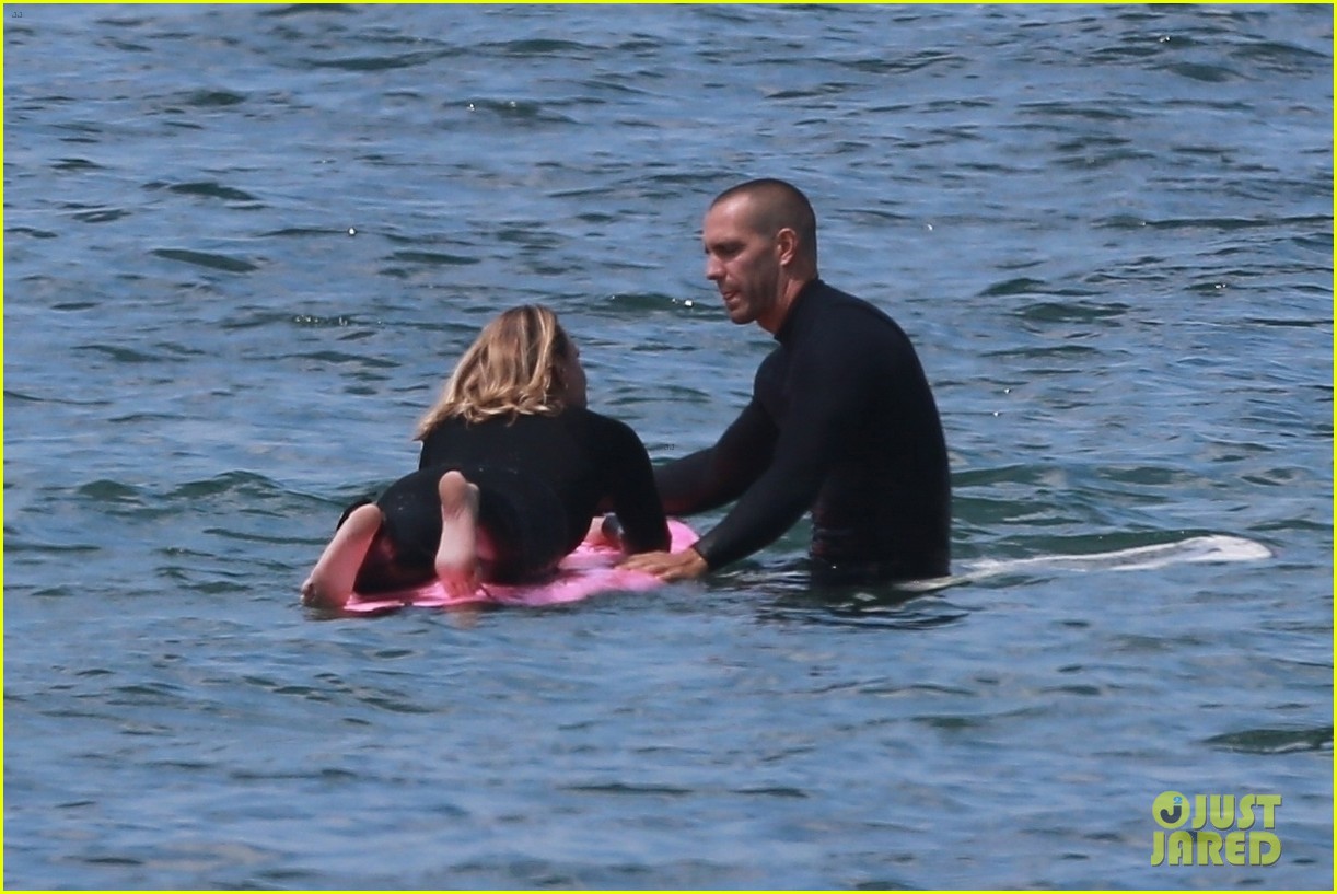 Photo: robin wright clement giraudet kisses while surfing 19 | Photo