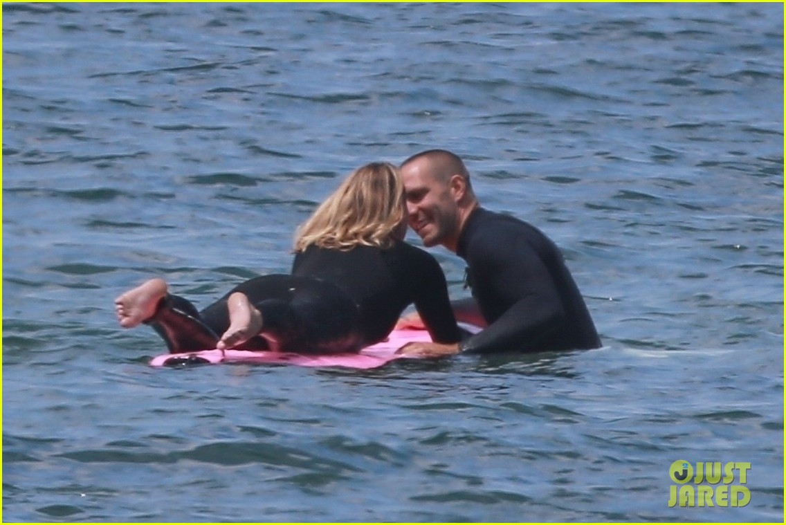 Robin Wright & Husband Clement Giraudet Share Kisses While Surfing