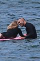 robin wright clement giraudet kisses while surfing 01