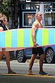 robin wright clement giraudet kisses while surfing 03