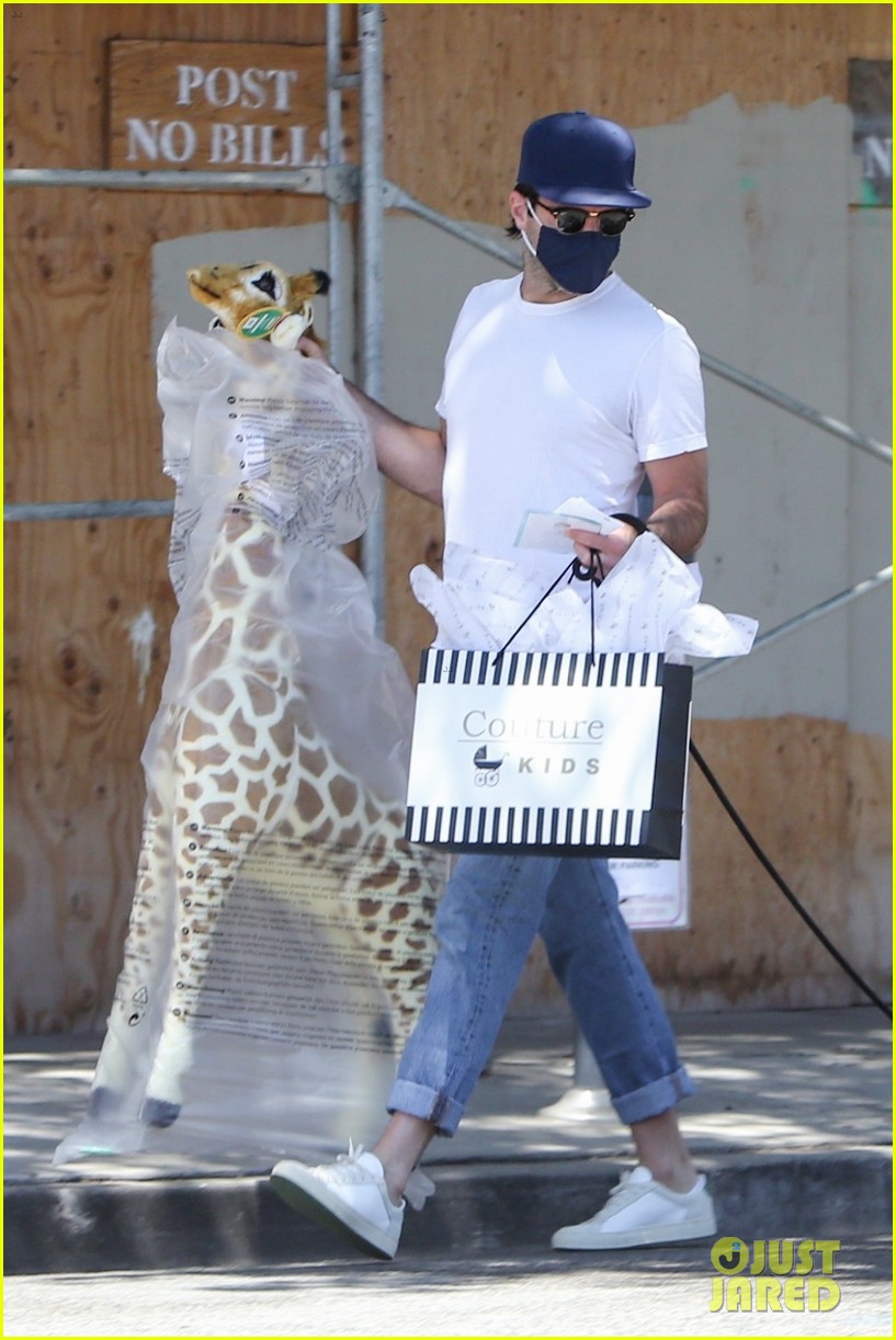 Zachary Quinto Carries Giant Stuffed Giraffe While Heading to a