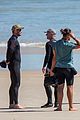 chris hemsworth skintight wetsuit at the beach 02