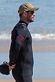 chris hemsworth skintight wetsuit at the beach 03