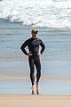 chris hemsworth skintight wetsuit at the beach 04