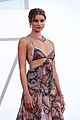 taylor hill matches mask to dress venice film festival 16