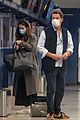 lily james dominic west hug airport 06