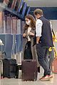 lily james dominic west hug airport 07