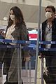 lily james dominic west hug airport 10
