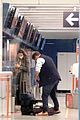 lily james dominic west hug airport 21