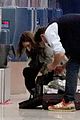 lily james dominic west hug airport 22