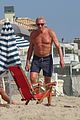 joe montana shirtless at the beach with his kids 55