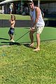 chris hemsworth jokes around while golfing with his son brother liam 06