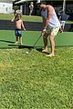 chris hemsworth jokes around while golfing with his son brother liam 08