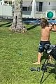 chris hemsworth jokes around while golfing with his son brother liam 09