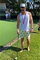 chris hemsworth jokes around while golfing with his son brother liam 16
