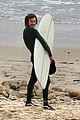 adam brody strips out of wetsuit surfing leighton meester 04