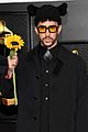bad bunny holds up a sunflower grammys 02
