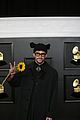 bad bunny holds up a sunflower grammys 03