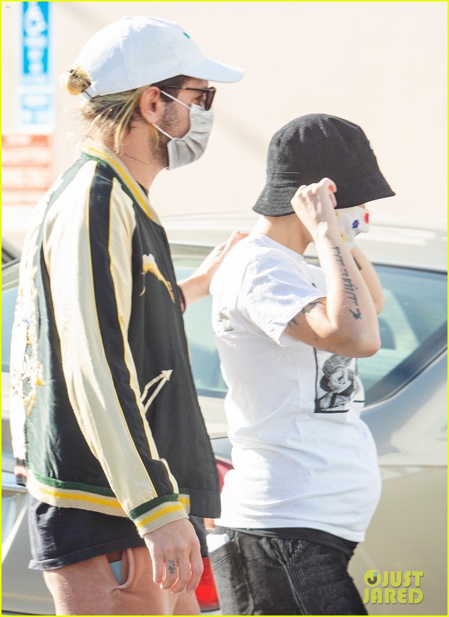 Halsey Covers Baby Bump in White T-Shirt While Out with Boyfriend Alev