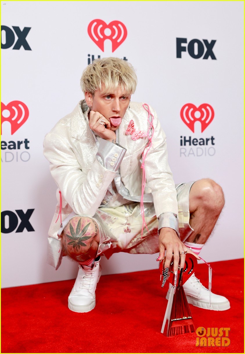 Megan Fox Wows in Pink Bodysuit While Supporting Machine Gun Kelly at