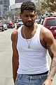 usher shows off his muscles tank shirt shopping in weho 02