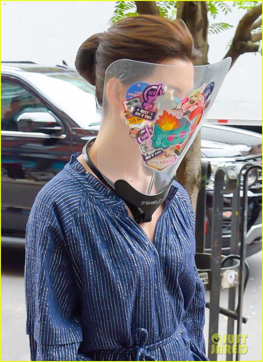Photo: anne hathaway wears face shield covered with stickers on