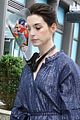 anne hathaway wears face shield covered with stickers on wecrashed set 03