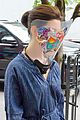 anne hathaway wears face shield covered with stickers on wecrashed set 04