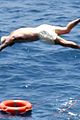 david beckham jumps off yacht with son cruz beckham 49