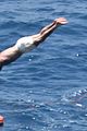 david beckham jumps off yacht with son cruz beckham 51