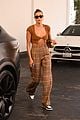 hailey bieber shows off fit figure in crop top sweater plaid pants 03